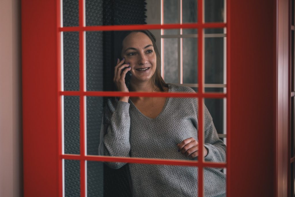 woman calling from a phone booth
